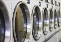 Laundry mat with open washing machine doors